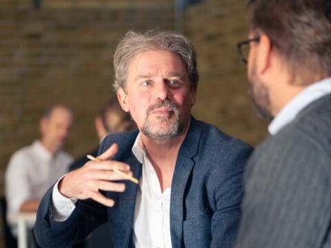 Men in open conversation during Embodied Relational Leadership session